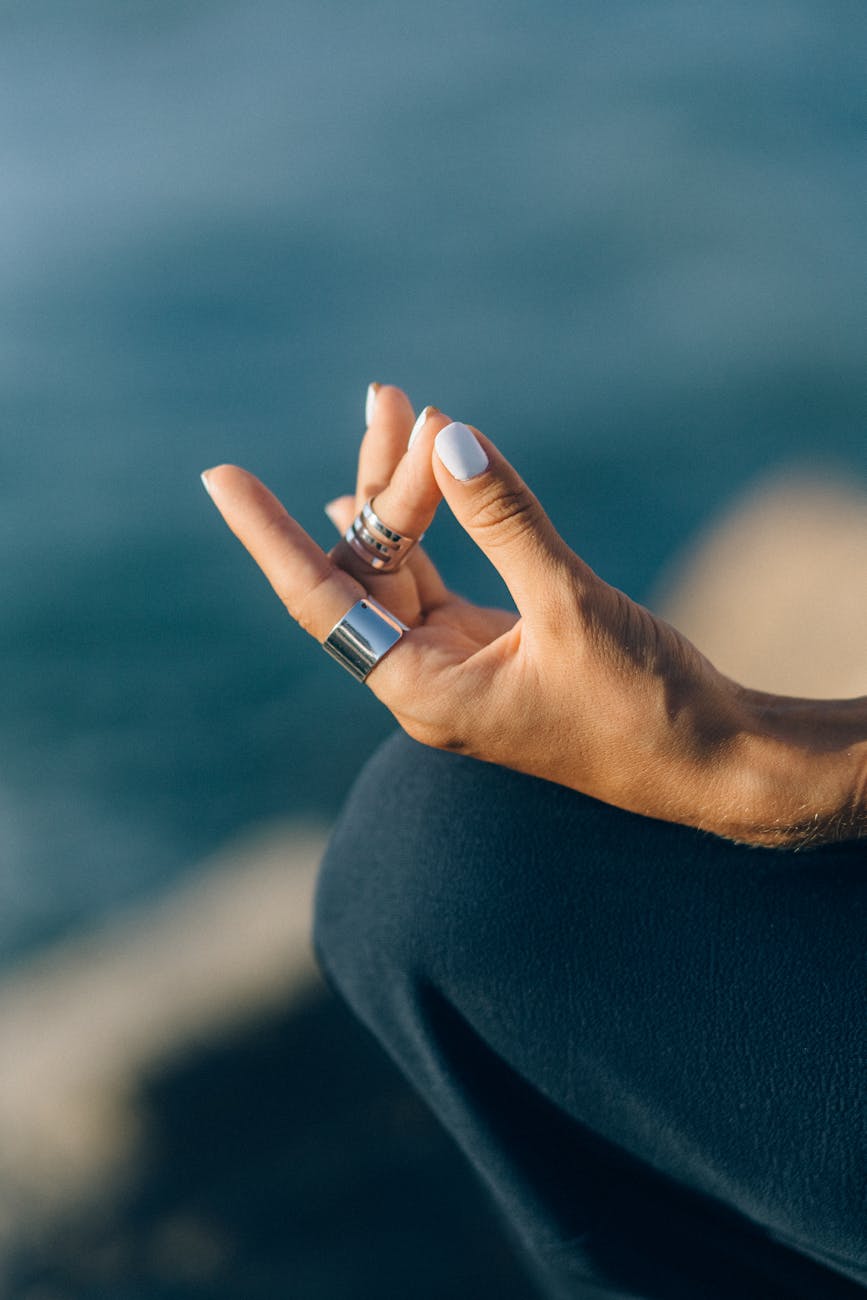 close up shot of a person meditating. still healing