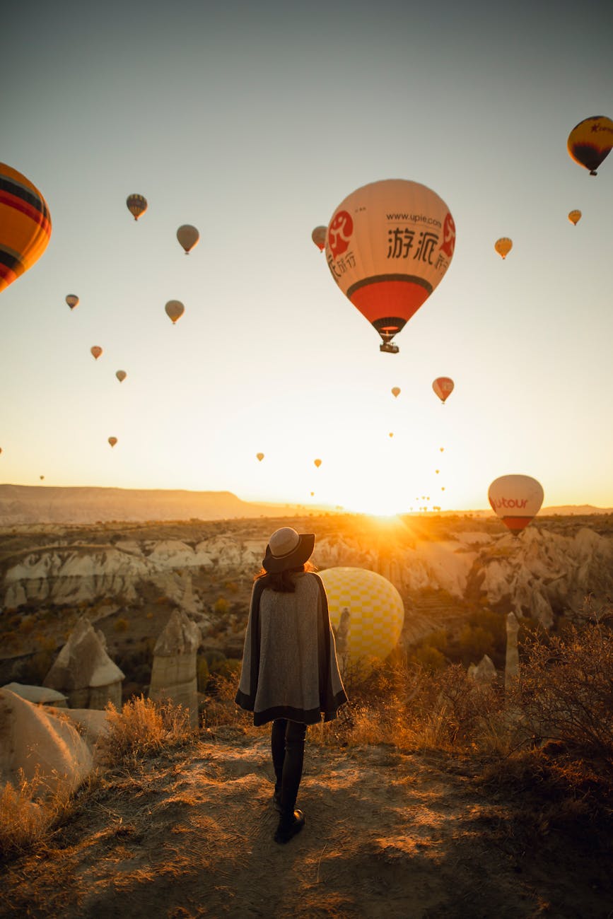 hot air balloons at sunrise in cappadocia. grace