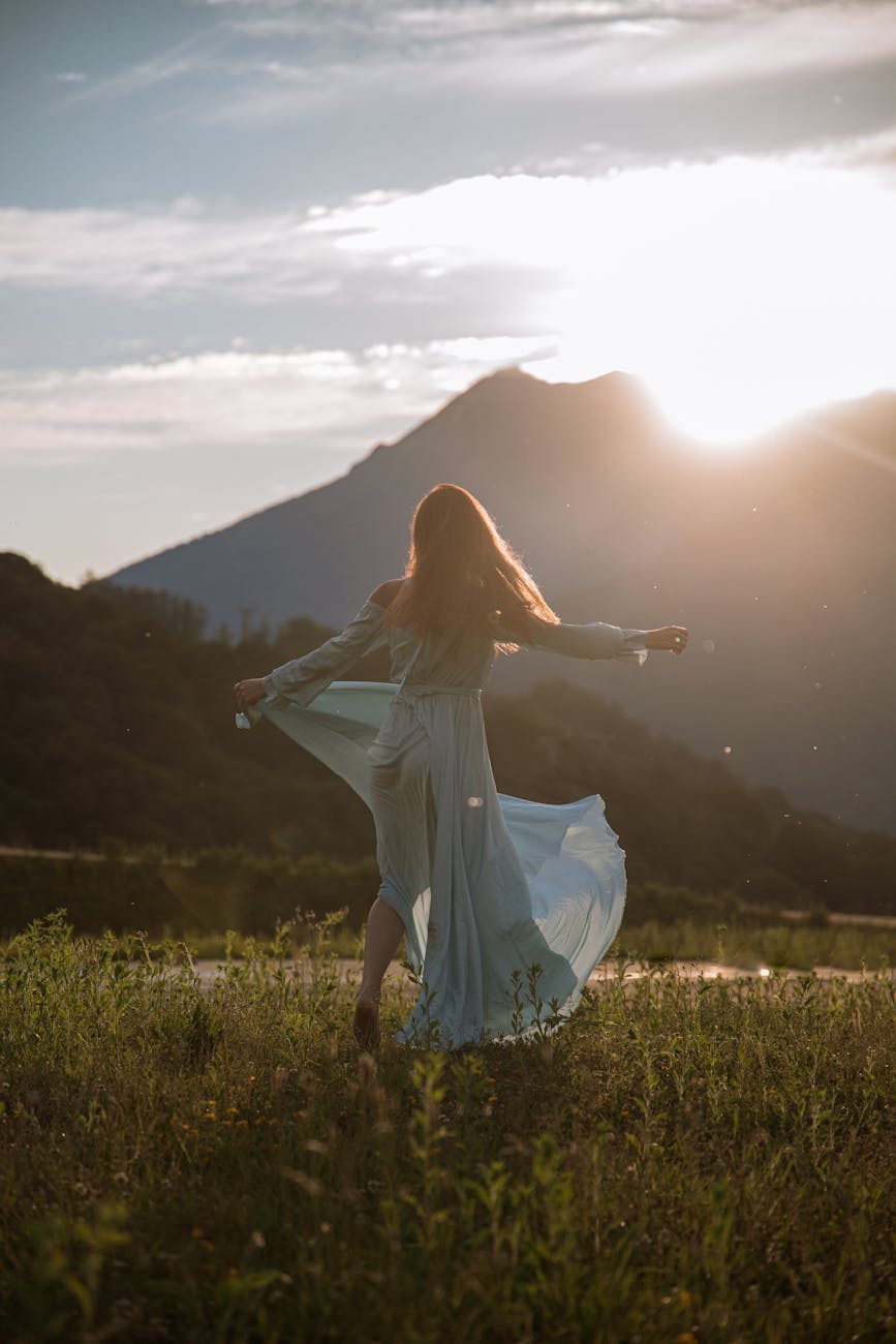 woman in blue dress spinning around
