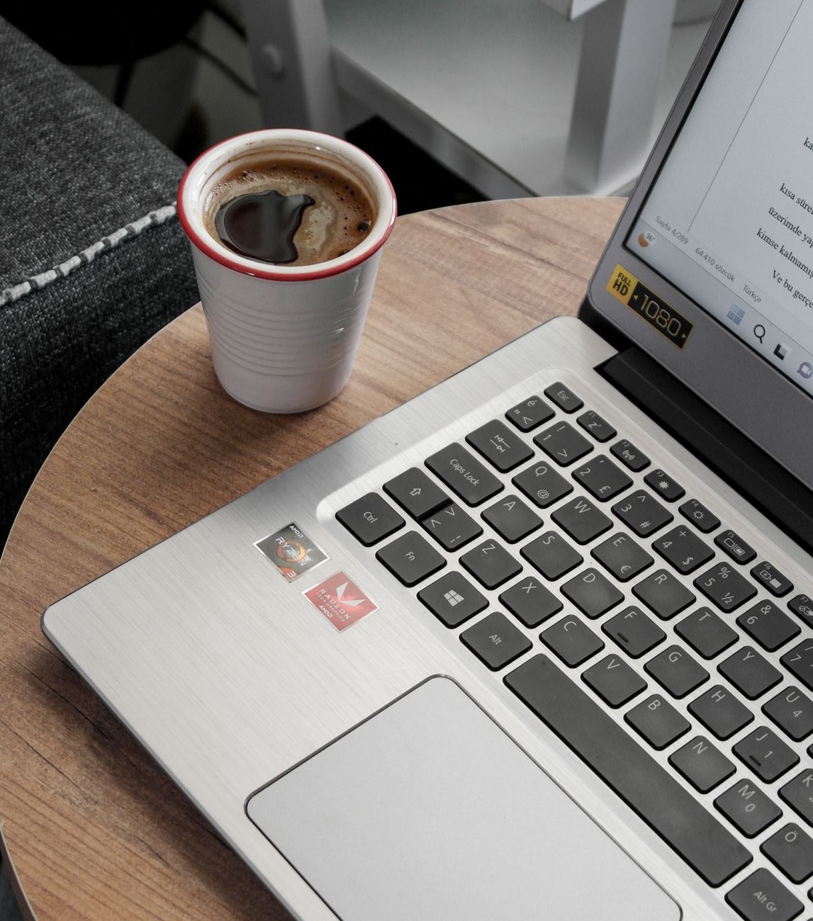 coffee cup by laptop